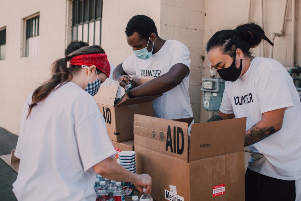 volunteers packing food aid for social impact